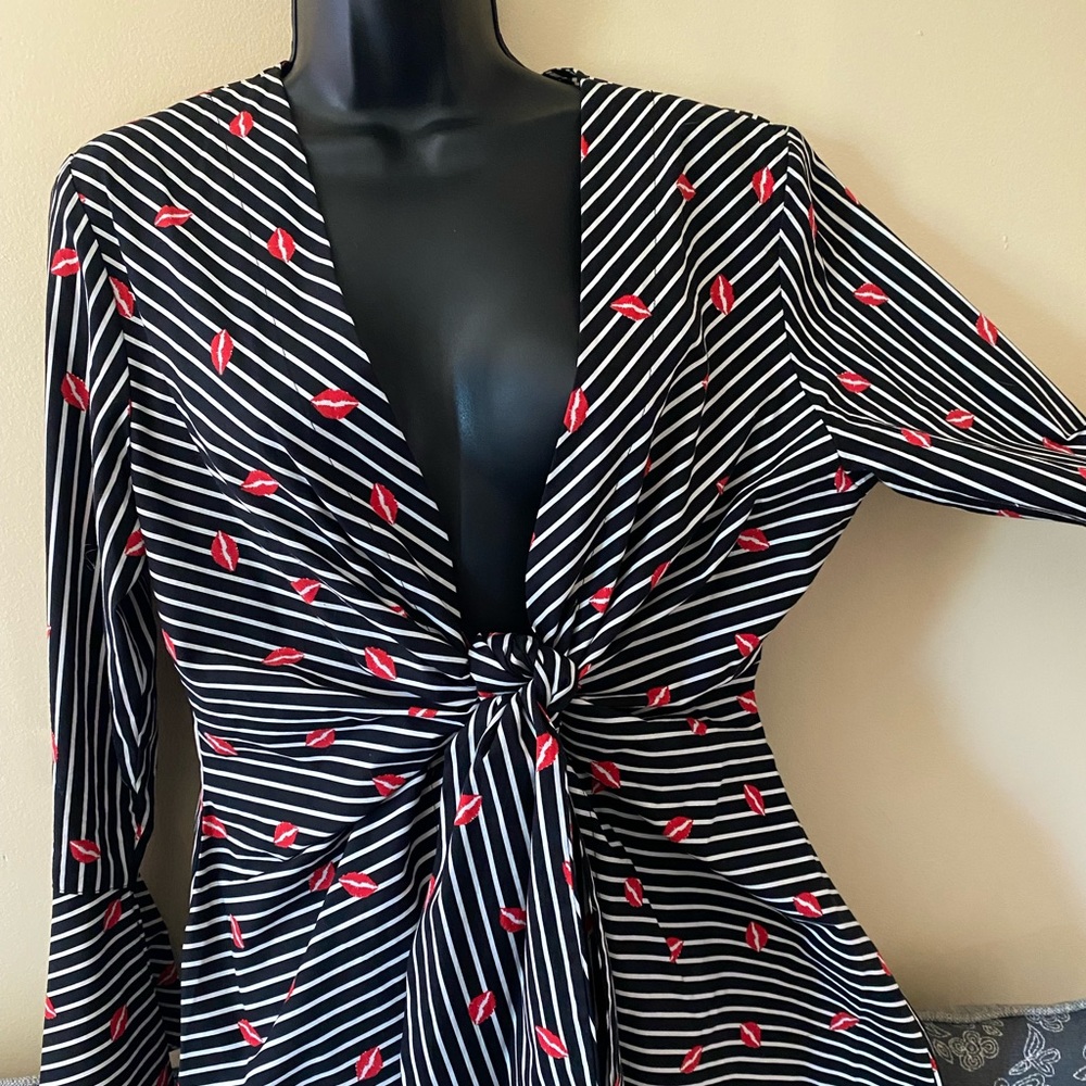 Cute tie front jacket with “Kisses “  Tie creates perfect cinched waist !